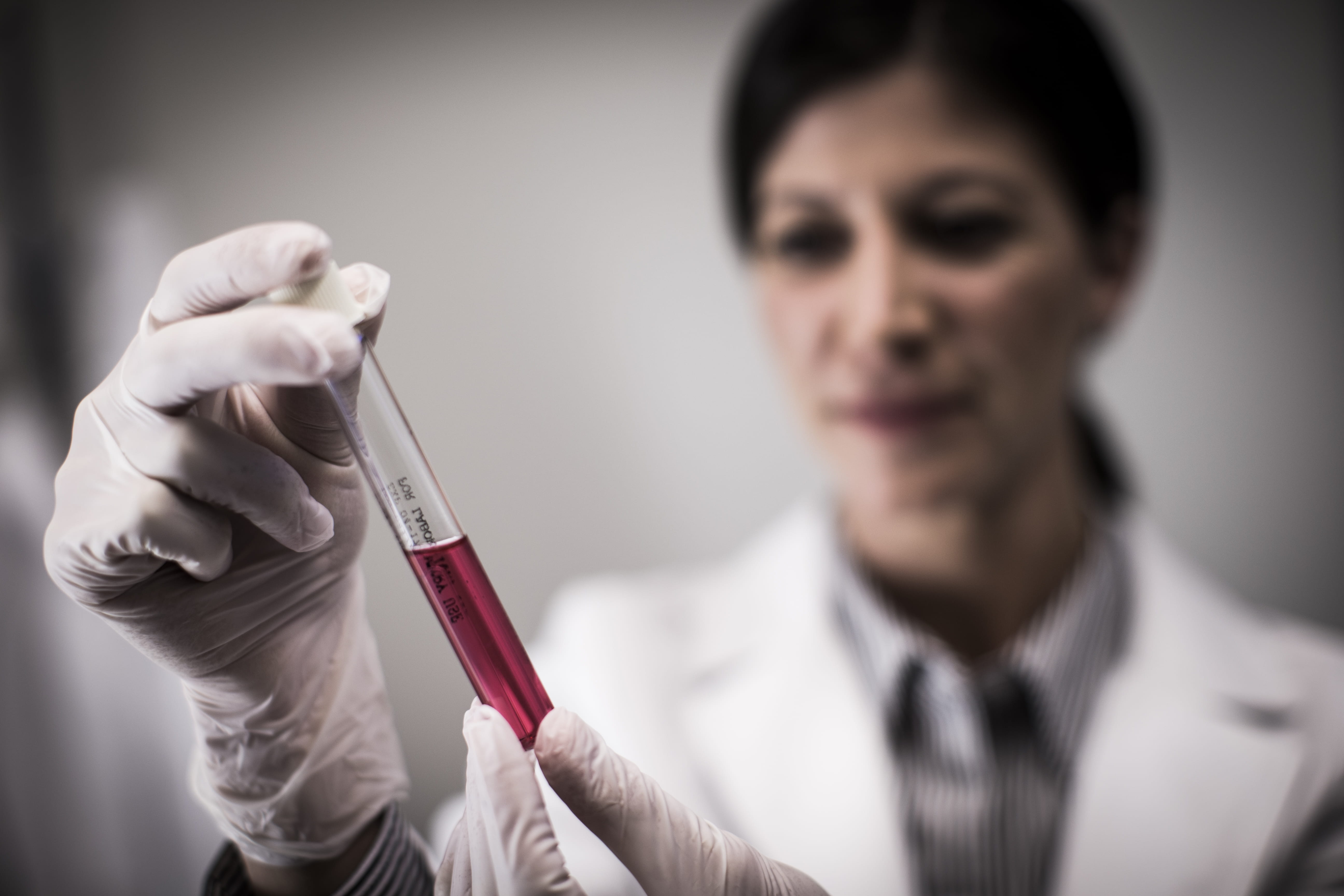 Female researcher with test tube
