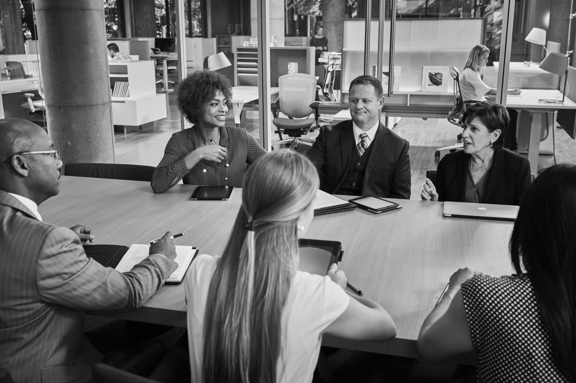 Associates meeting in a conference room