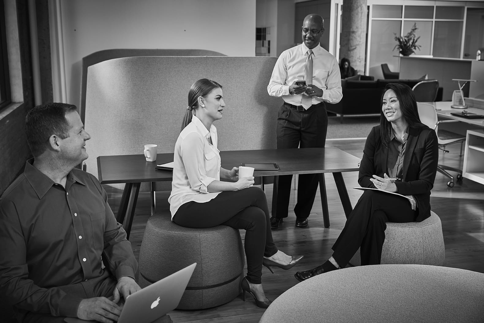 Associates meeting in the kitchen area